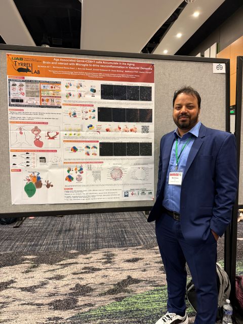 Md Akkas Ali standing beside his research poster at the AGE 2026 Annual Meeting